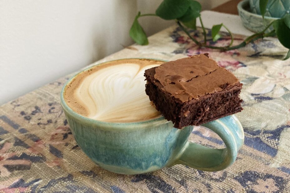 Reliable Brownies with a latte in a green mug
